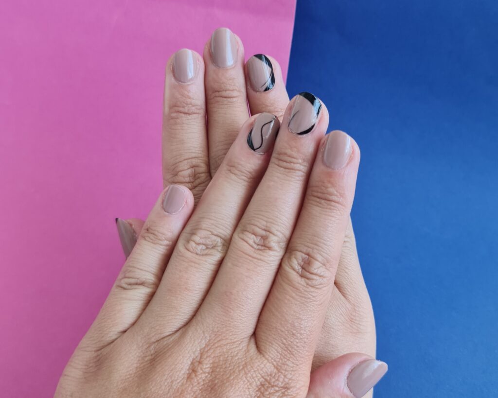 Manicure with two nail stickers at once makes the nail art world endless